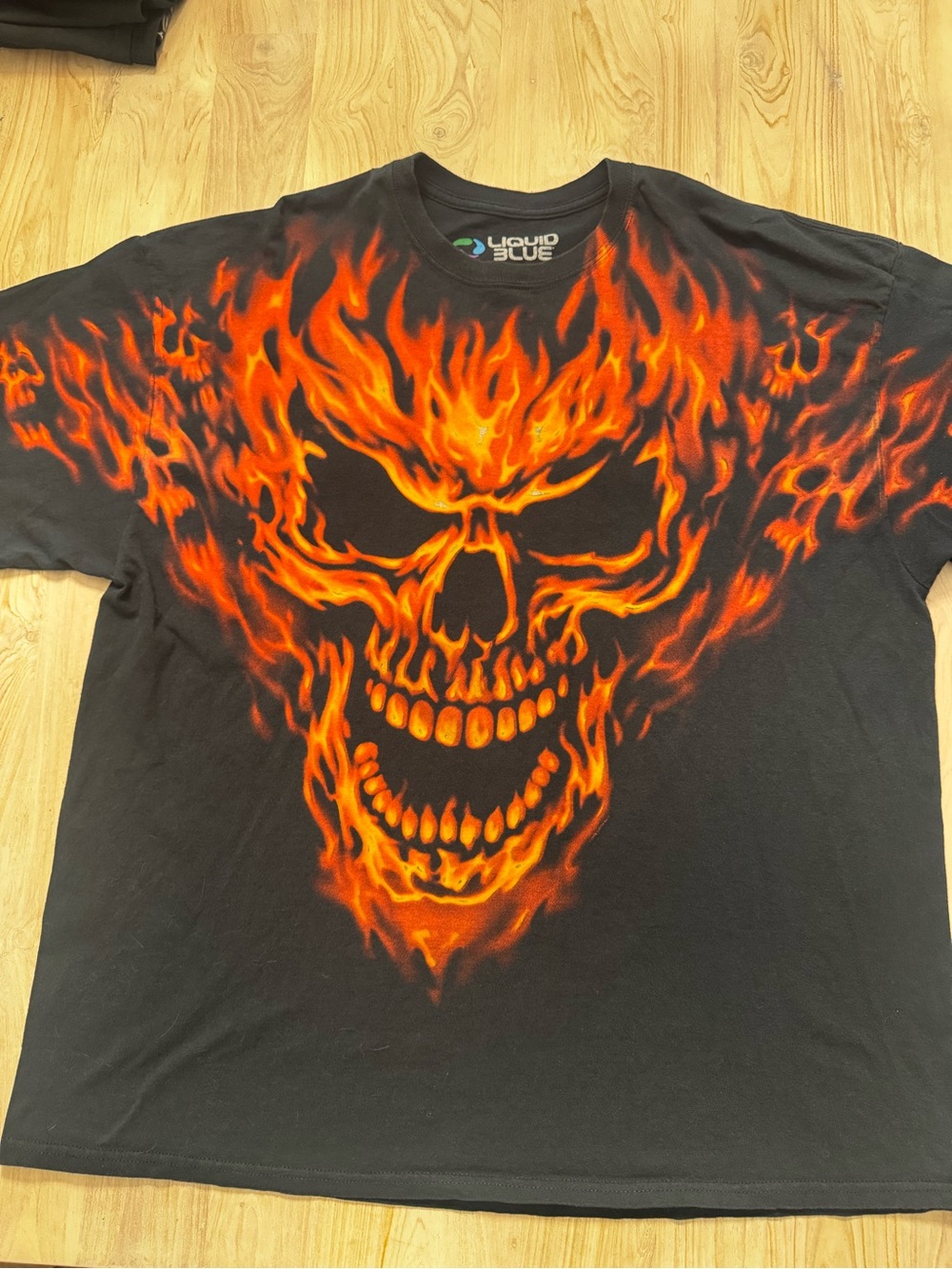 Liquid Blue Black T-Shirt with Fiery Skull Flame Graphic